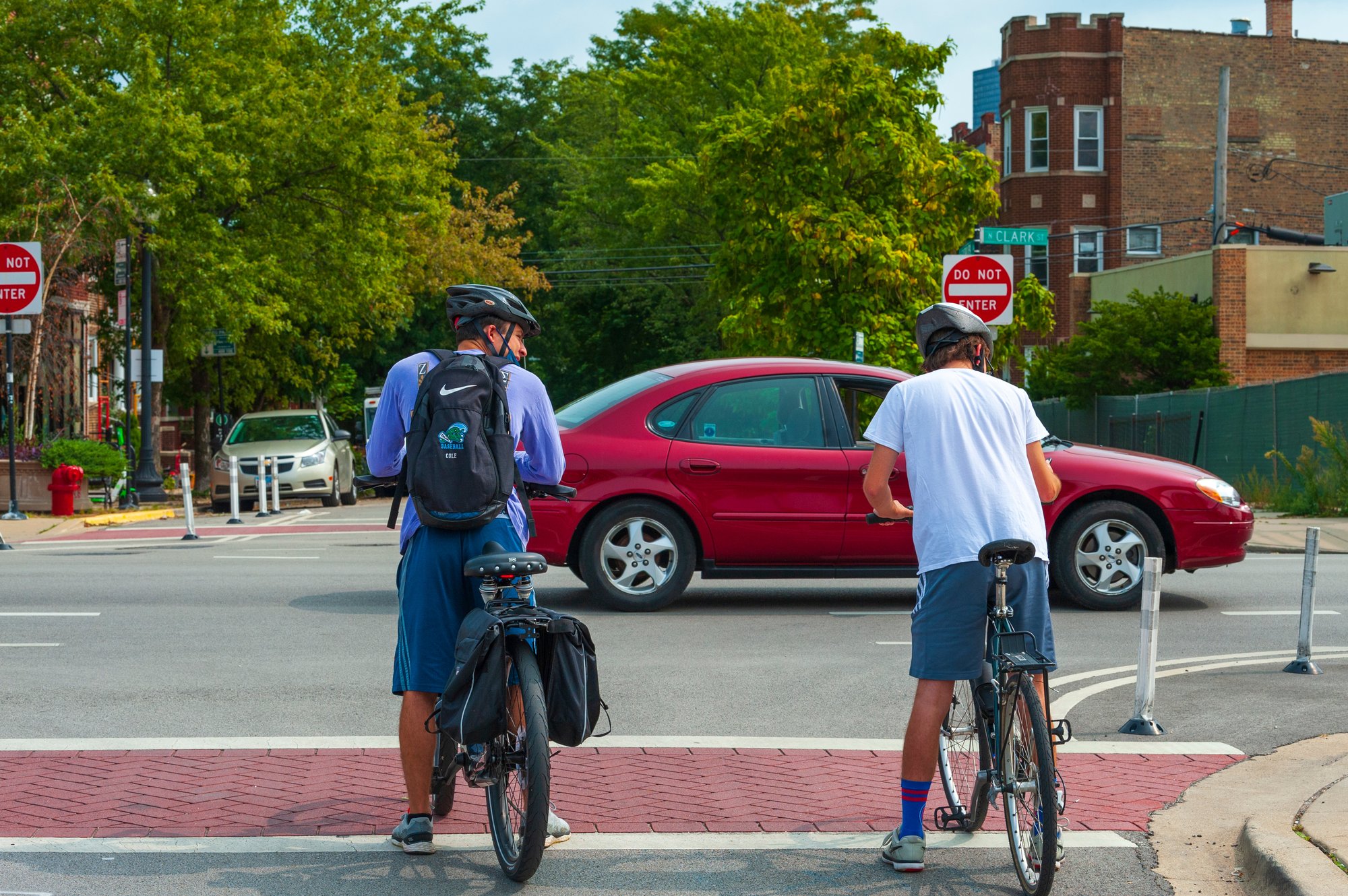 Bicyclists stopped at intersection of Ashland and Catalpa